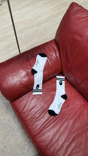 These white A Bathing Ape (BAPE) socks feature the...
