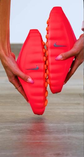 This shoe is Nike Mind 001 in Solar Red.