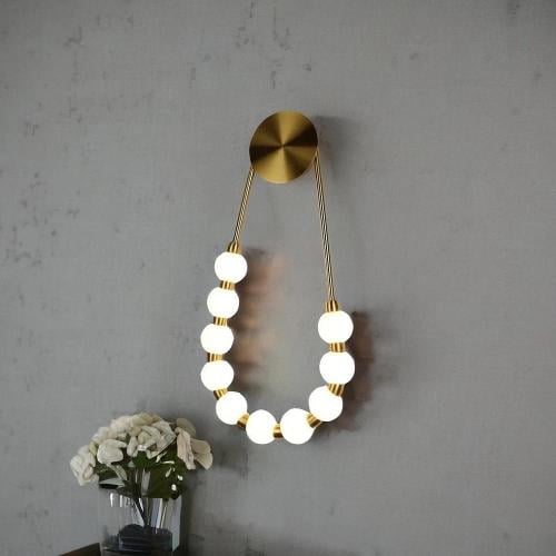 ابليك جداري مودرن ذهبي فاخر على شكل عقد 3 إضاءات 1...