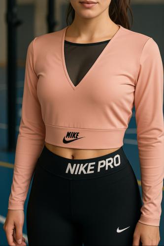 تيشيرت رياضي نايك شبك باللون الوردي