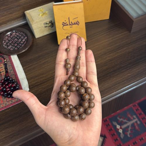 A rosary scented with cinnamon fragrance
