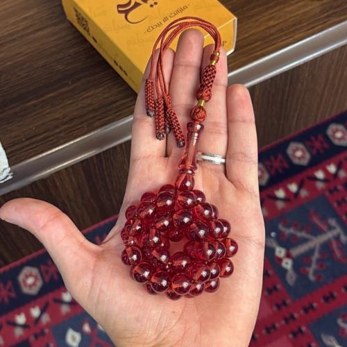 مسباح زعفراني فواح بلون مايل للعنابي الشفاف