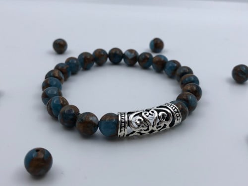 سوارة بحجر ازرق وبني