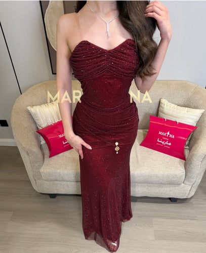 فستان الجمال (فستان برغندي كلفه شك مطرزه)