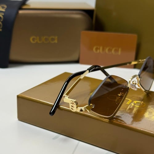 نظارة قوتشي باللون الذهبي بعدسة مثلثة باللون البني