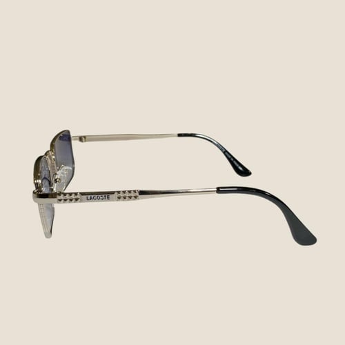 نظارة لاكوست بعدسة مستطيلة باللون الفضي