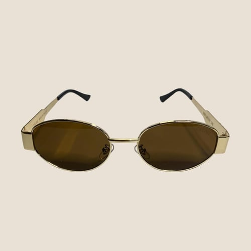 نظارة سيليN باللون الذهبي وإطار بيضاوي بعدسة بني