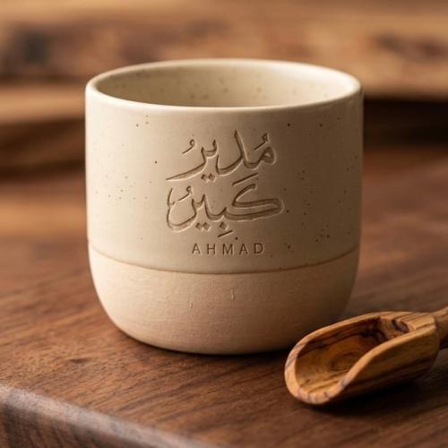 A large engraved manager cup with name customizati...
