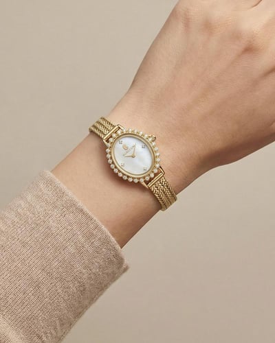 ساعة خاتون نسائية بتصميم بيضاوي ذهبي للنساء