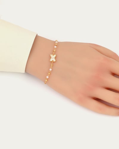 إسوارة نسائية ناعمة تصميم ذهبي مع حلية على شكل X