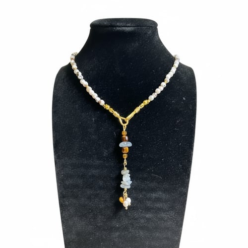 قلادة الأجات الأبيض، حجر الطاووس، وعين النمر