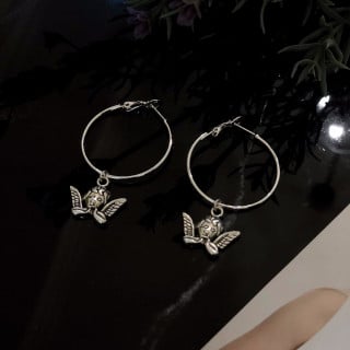 حلق دائري مع ملاك فضي | Silver hoop earrings with...