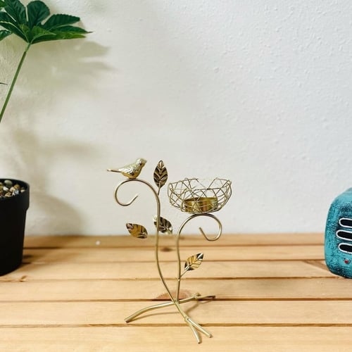شمعدان ذهبي عصفور ع غصن شجرة