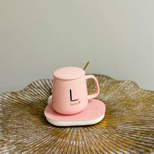 فنجان قهوة بغطاء زهري وملعقة ذهبية مع قاعدة تحافظ...