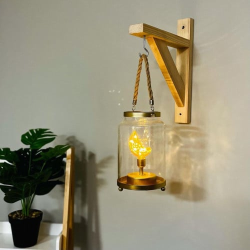 فانوس مطربان زجاج وحديد ذهبي وتعليقة حبل و بداخله...