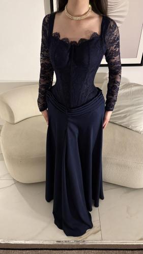 A navy blue dress tells a story