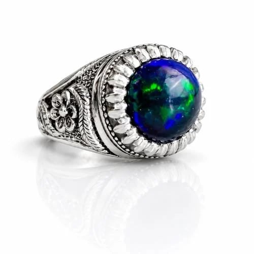 Dark blue opal ring with fire effect