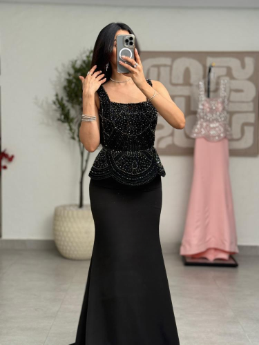 Black dress embroidered with luxurious details without sleeves