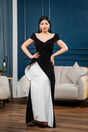 A black dress intertwined with white with an elegant wrap design