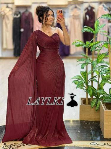 A maroon dress with one shoulder and luxurious dra...