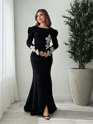 A black dress with luxurious silver embroidery