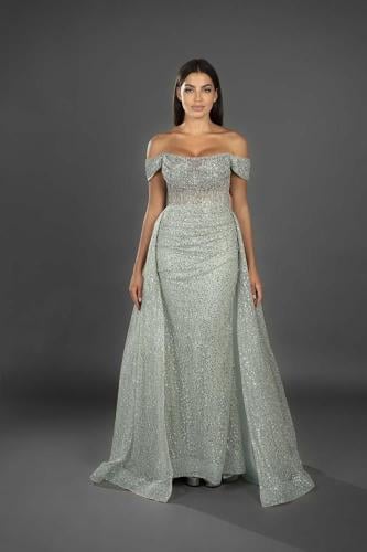 A shiny silver dress with luxurious off-shoulder sleeves