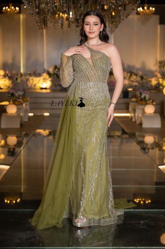 An olive dress with one shoulder and silver embroidery