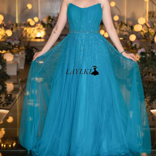 Turquoise dress with shiny embroidery and luxurious flow