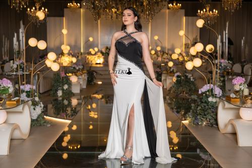 A white and black dress with a luxurious modern design
