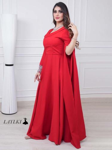 Red dress embroidered with a royal cape