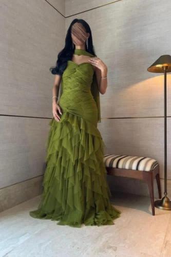 An olive green dress with soft layered tulle