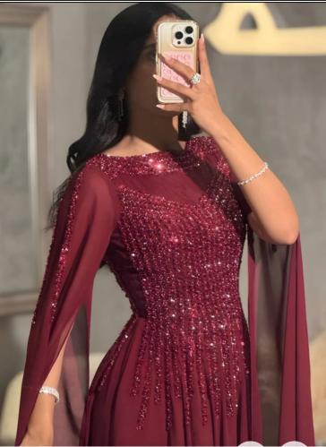 Maroon dress embroidered with draping sleeves