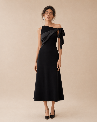 A black dress with a shoulder tie detail.