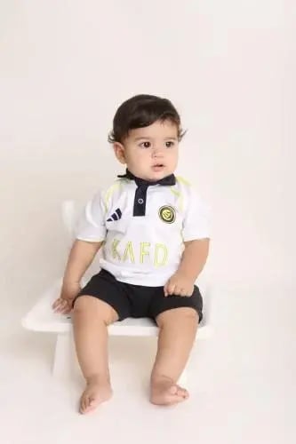 طقم اطفال نادي النصر الاحتياطي | نقاء الأبيض للمشج...