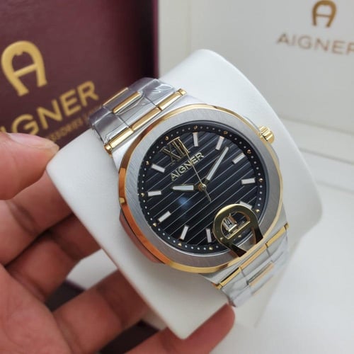 ساعة اقنر رجالية فضي ذهبي ميناء اسود