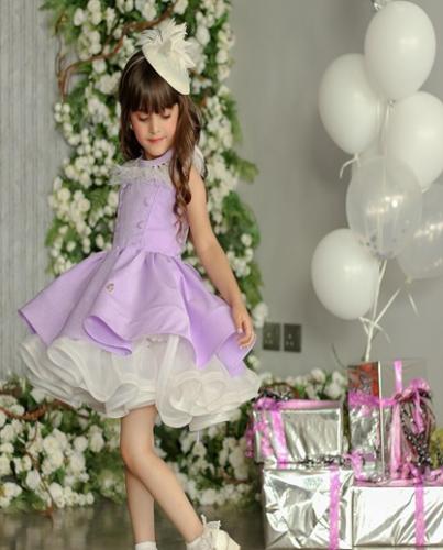 A purple dress with a white feather collar