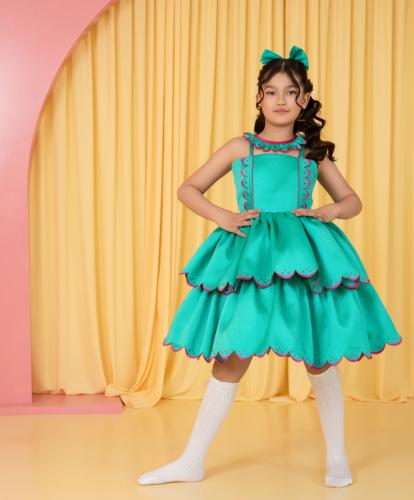 Layered embroidered dress decorated with hand-sewn beads