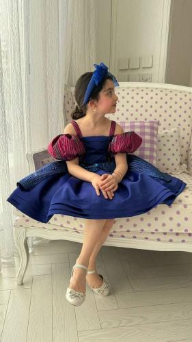 An attractive dress in striped colors with luxurio...