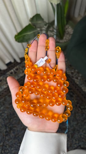 Orange cast prayer beads