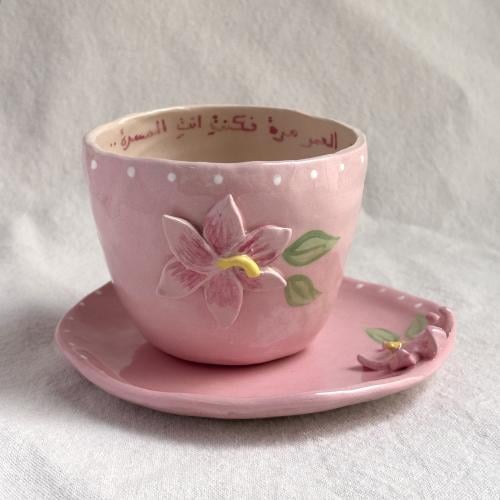 A cup + plate with the phrase: "I was pleased in life once, so I was..."