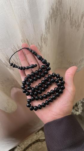 Black color prayer bead with tear-shaped pendant,...