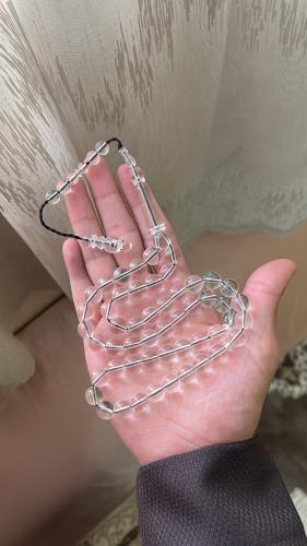 Transparent plastic prayer bead with a clear desig...