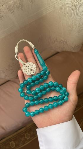 A prayer bead bracelet with turquoise ceramic and...