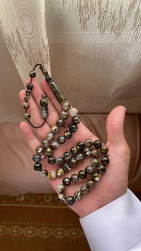 A brown mixed color prayer bead with a clip, for g...