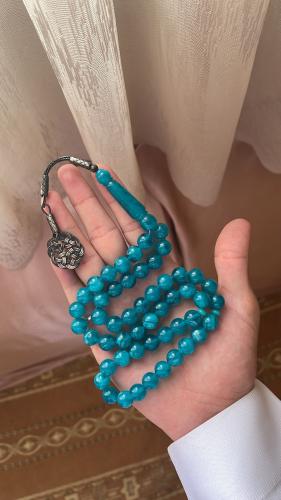 A prayer bead bracelet with turquoise ceramic and...