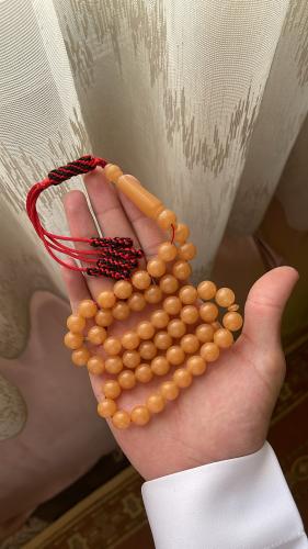 A luminous light-colored prayer bead, Karkoush, Ku...