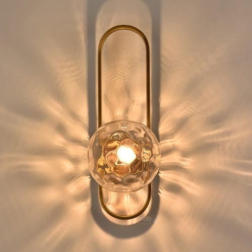 أبليك ذهبي مودرن مع كرة زجاجية مضيئة