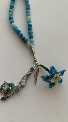 سبحة 33 عقيق برازيلي أزرق فيروزي مزينة بوردة أويا...