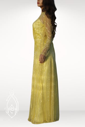 فستان اصفر مطرز ومشكوك يدويا بخرز انيق برسمة غير م...