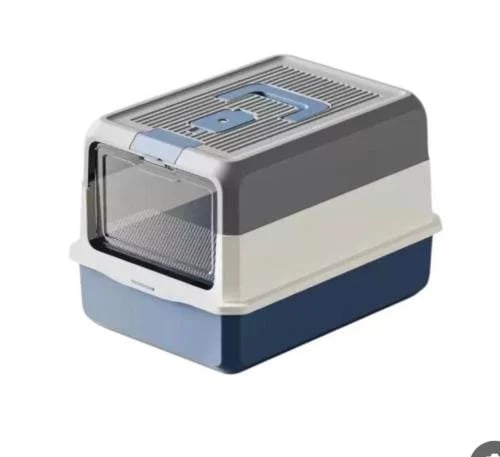 Closed litter box equipped with a door and a scoop...